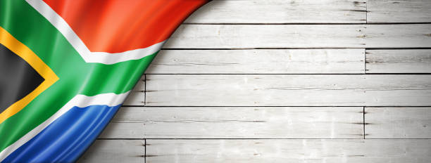 istock South African flag on old white wall banner 1291142902