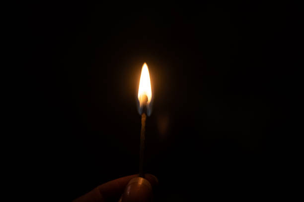 istock Burning match in the dark close up 1291143755