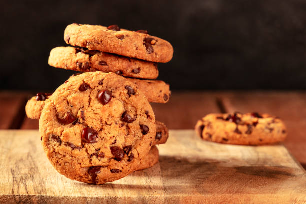 istock Chocolate chip cookies on a dark rustic wooden background 1291147068