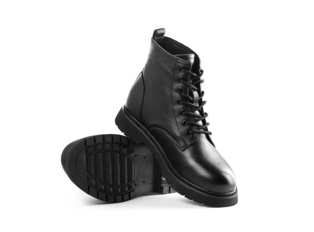 istock Black leather boots with laces. Close up. Isolated on a white background 1291147351