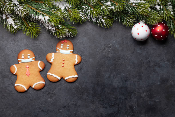 istock Greeting card with gingerbread cookies in face mask 1291148215