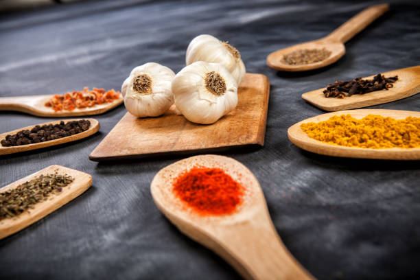 istock Various spice on wooden spoons with herbs 1291148242
