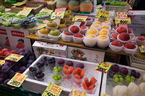 Horizontal close-up view of one of the Omicho fresh food market fruit stalls in Kanazawa, Japan