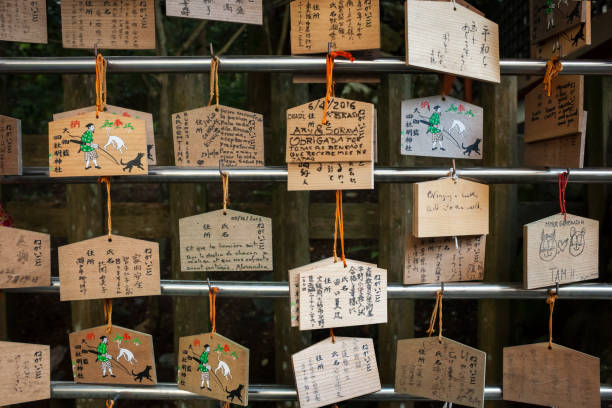 Horizontal view of some rows of Ema, wooden votive plaques with wishes and prayers, in Danjo Garan (Garan) Buddhist complex, Koyasan, Japan. Garan was constructed by Kobo Daishi (Kukai, the leader of the esoteric Buddhism)