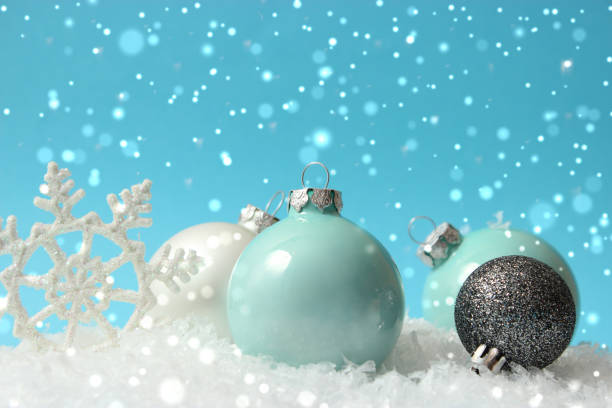 istock Beautiful background Christmas or New Year with a place for text on a colored background with bokeh of lights and snow 1291151692