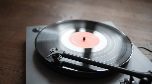 istock Turntable playing vinyl LP record at home 1291153181