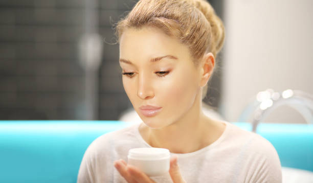istock Magic anti-aging cream.Applying the cream 1291157278