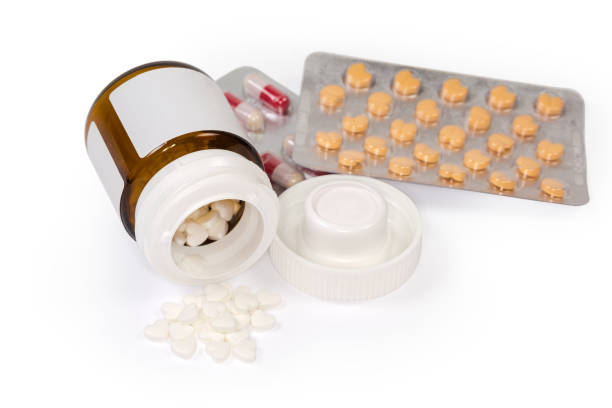 istock White heart shaped pills against the other medications 1291162608