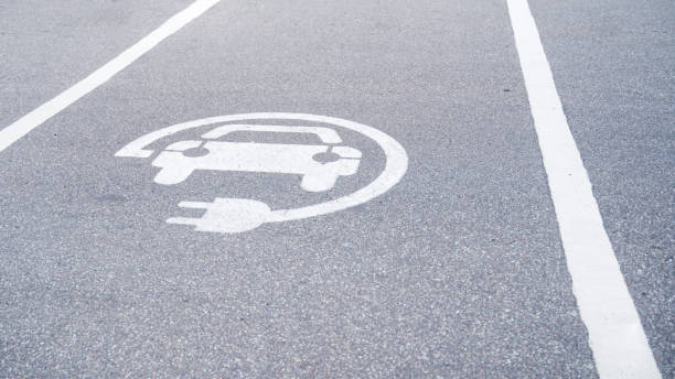 istock sign on the pavement charging for electric vehicles 1291164184