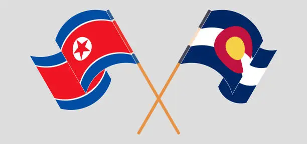 Vector illustration of Crossed and waving flags of North Korea and The State of Colorado