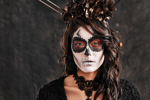 Cropped portrait of an attractive young woman dressed in her Mexican-style halloween costume