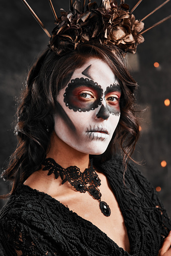Cropped portrait of an attractive young woman dressed in her Mexican-style halloween costume