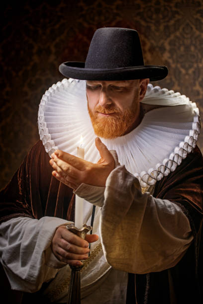 istock Redhead traditional dutch man by candlelight 1291166145