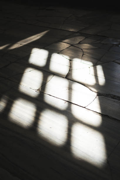 istock Shadow of the window on the concrete floor. 1291167106