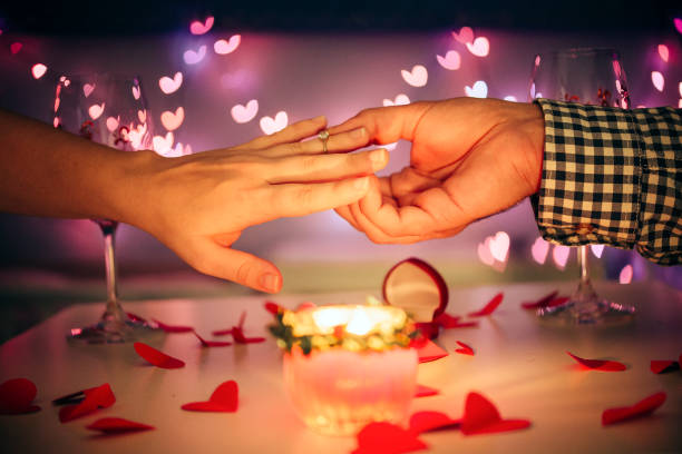 istock Man Giving Girlfriend Engagement Ring, Romantic Date In Restaurant on Valentines day 1291168794