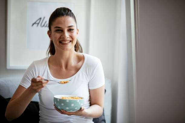 istock Woman eating a healthy breakfast. 1291168802