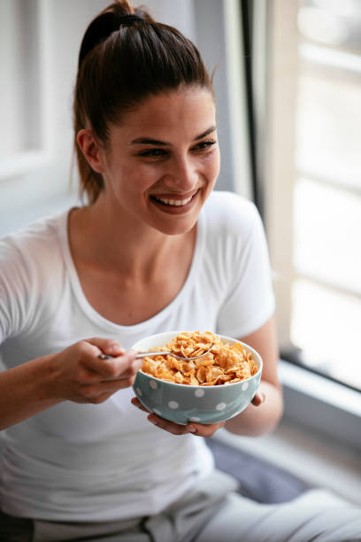 istock Woman eating a healthy breakfast. 1291168979