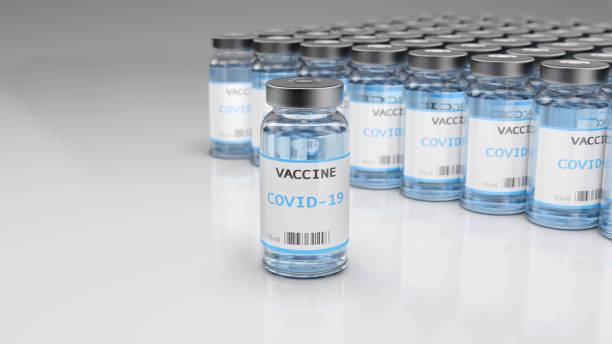 istock Vaccine for Covid-19. Dose bottles on a gray background. 3d render 1291169101