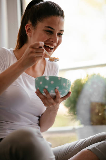 istock Woman eating a healthy breakfast. 1291169814