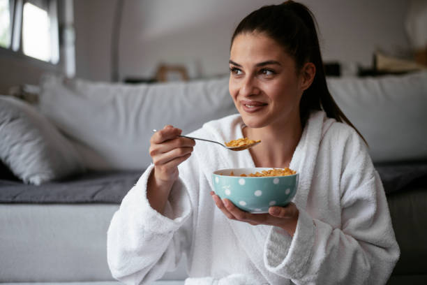 istock Woman eating a healthy breakfast. 1291170536