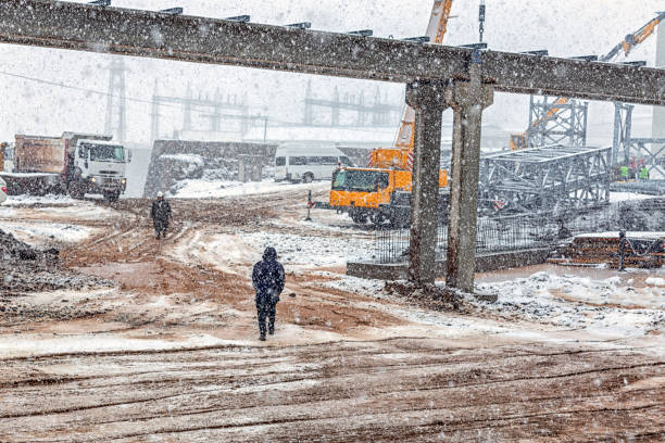 istock View of the construction site with snowy weather. Construction is a general term meaning the art and science to form objects, systems, or organizations. 1291171908