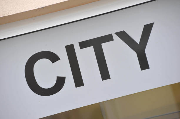 istock Black letters spelling City on white background 1291173394