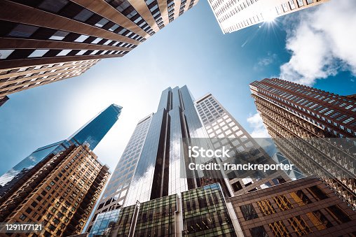 istock low angle of tall building in manhattan 1291177121