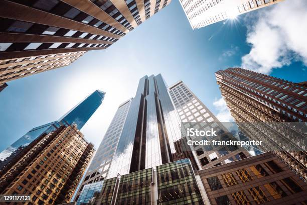 Low Angle Of Tall Building In Manhattan Stock Photo - Download Image Now - Building Exterior, New York City, Construction Industry