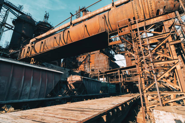 istock Large iron constructions of metallurgical plant and freight wagons infrastructure 1291180480