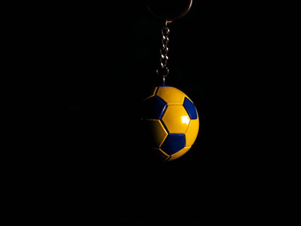 istock Keychain soccer ball on a black background. 1291180877