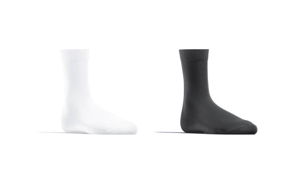 istock Blank black and white long socks mockup stand, half-turned view 1291181579