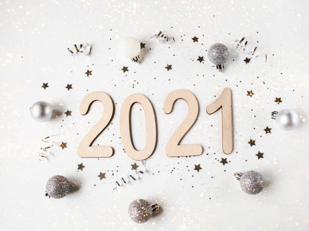 istock Flat lay white New year composition - numbers 2021 and confetti 1291181969