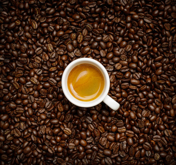istock cup of coffee with freshly roasted coffee beans background 1291182183