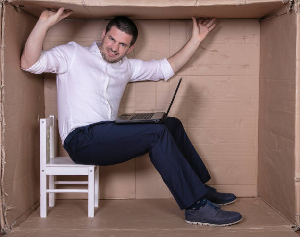 istock broken businessman in a cardboard office, stress and depression from overwork 1291183184