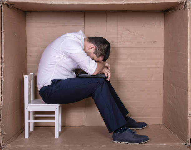 istock broken businessman in a cardboard office, stress and depression from overwork 1291183307