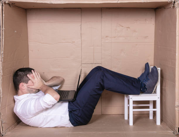istock broken businessman in a cardboard office, stress and depression from overwork 1291183369