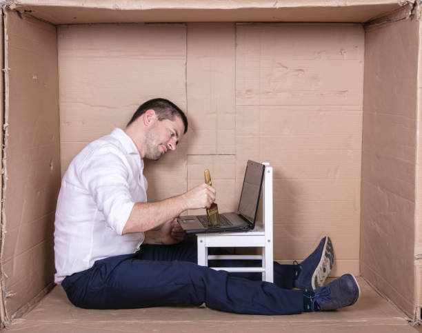istock businessman seated in his cramped office satisfied with his work 1291185181