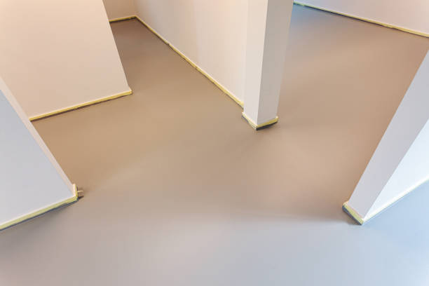istock Fresh grey painted floor with yellow masking or painters tape 1291185281