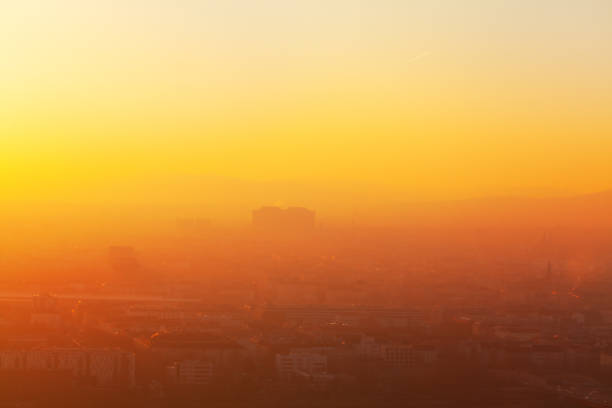 Fog over the city in the twilight . Haze in the Dusk and city panorama