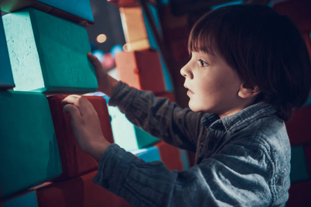 istock Cute Little Boy Playing with Soft Building Blocks 1291191875