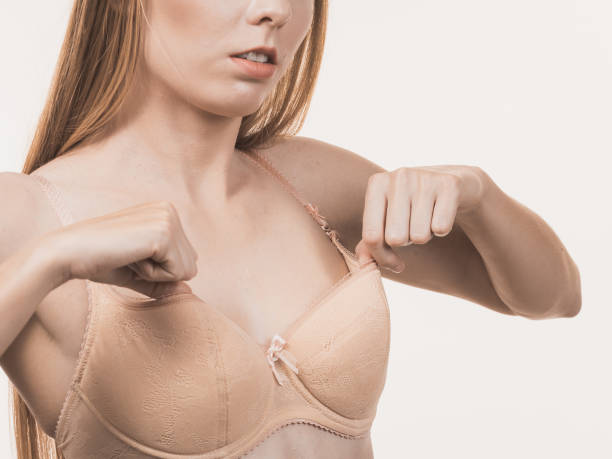 istock Female wearing too big bra, wrong size 1291194522