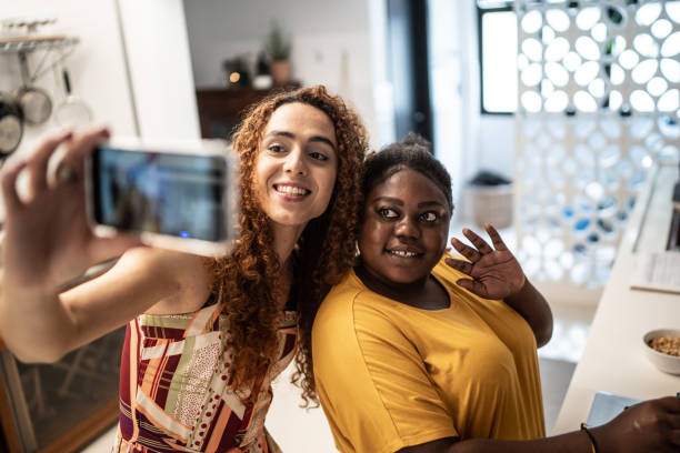 istock Friends doing a video call or taking a selfie while cooking at home 1291194792