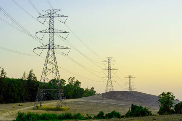 istock Electricity pole with silhouette sunset sky 1291200132