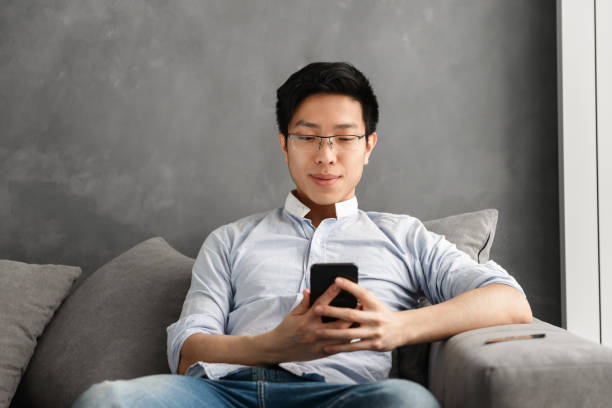 istock Portrait of a smiling young asian man 1291200518
