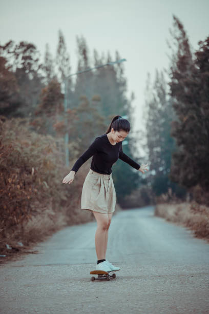istock Girl and Skateboard. 1291204610