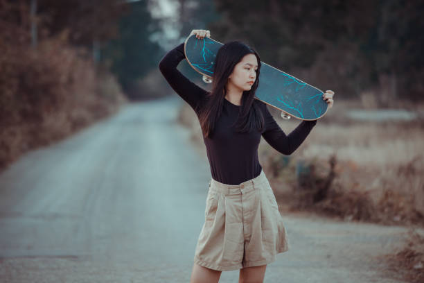 istock Girl and Skateboard. 1291204649