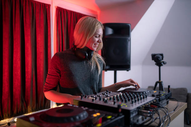 istock Beautiful DJ girl mixing electronic music 1291207832