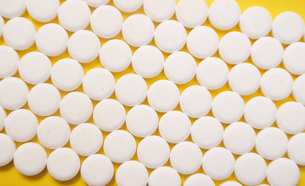 istock Pills on colorful background 1291210257