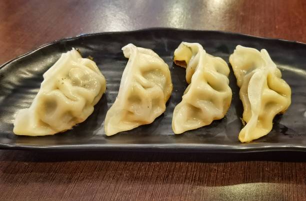 istock Gyoza or dumplings snack with soy sauce, selective focus 1291210562