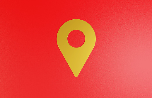 Golden Pin symbol on a red background. Horizontal composition with copy space.